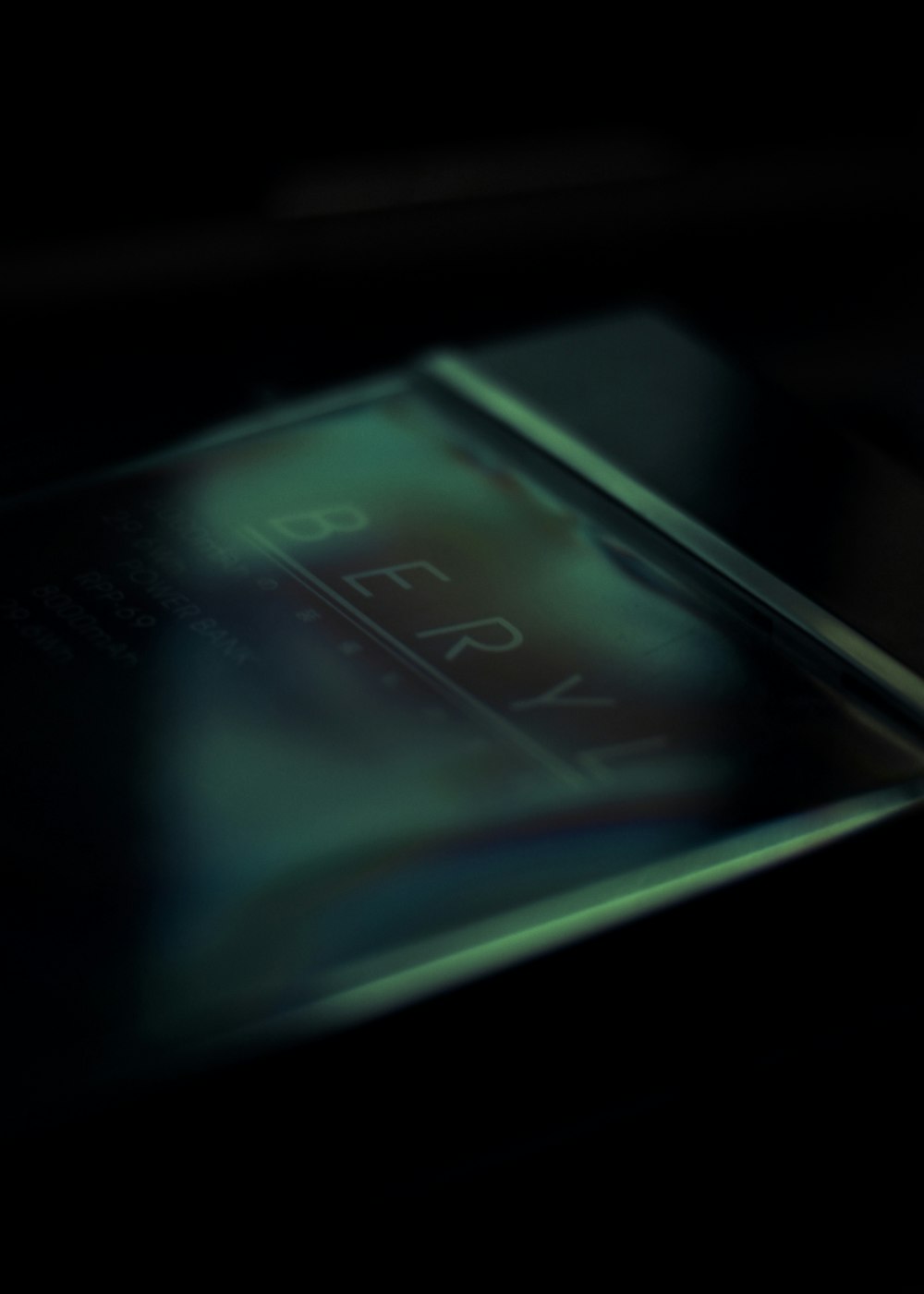 a close up of a cell phone in the dark