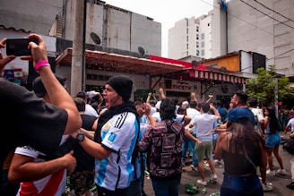 Fans celebrating a new signing outside the stadium.