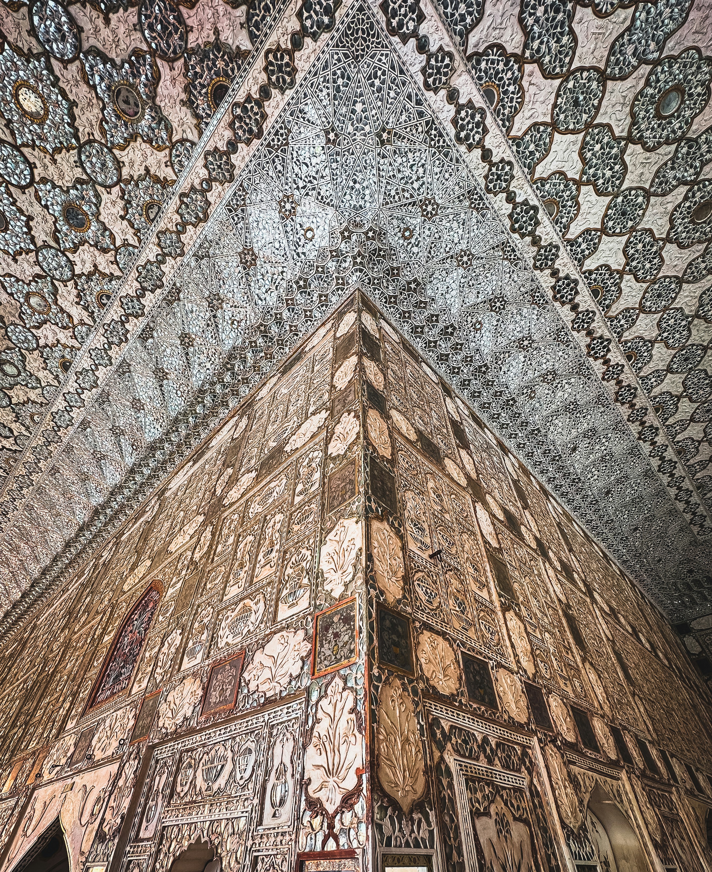 the ceiling of a building has intricate designs on it