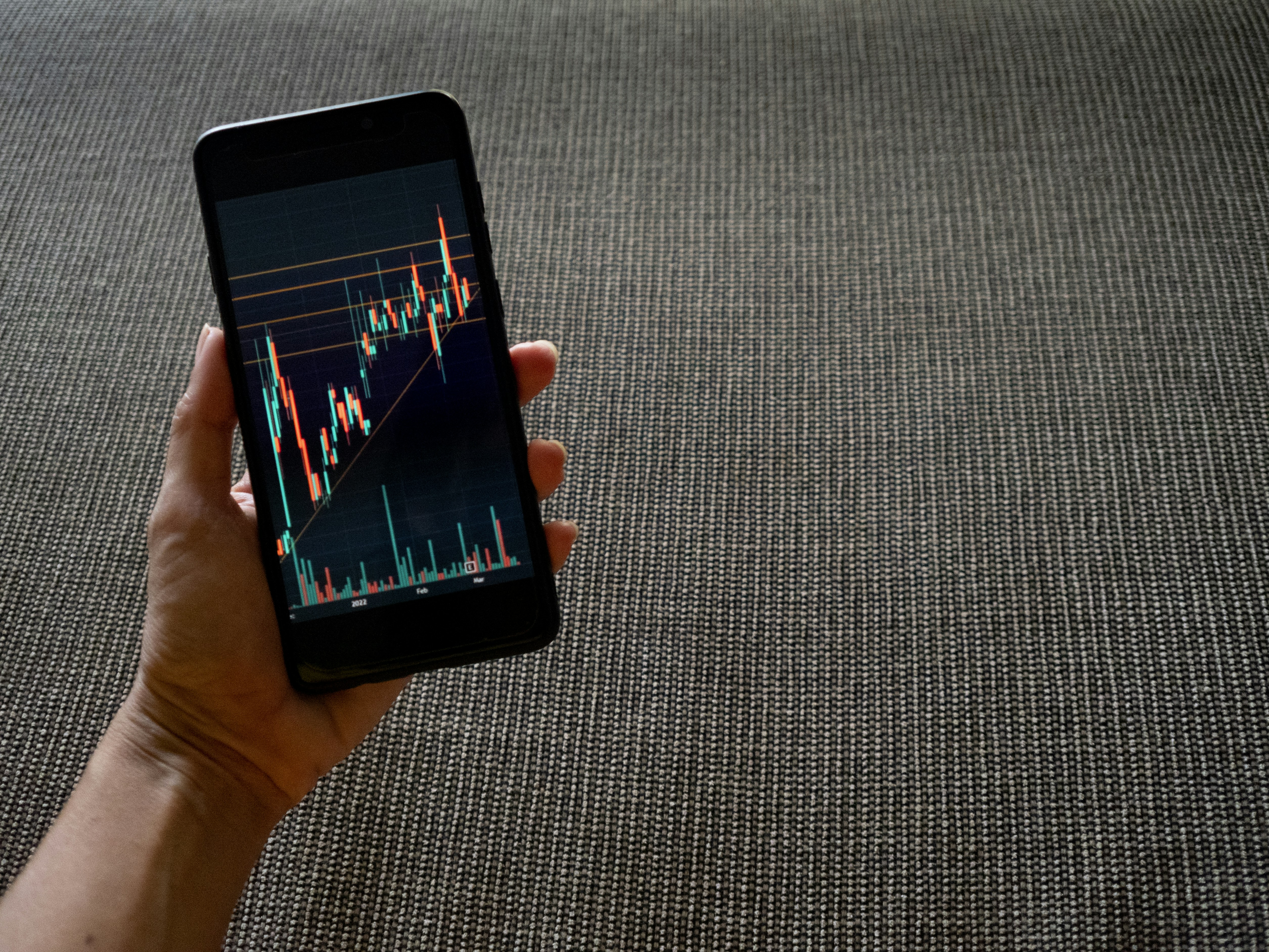 smartphone displaying video analytics dashboard graph