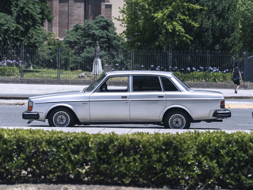 a silver car parked on the side of the road