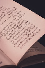 a close up of a book with writing on it