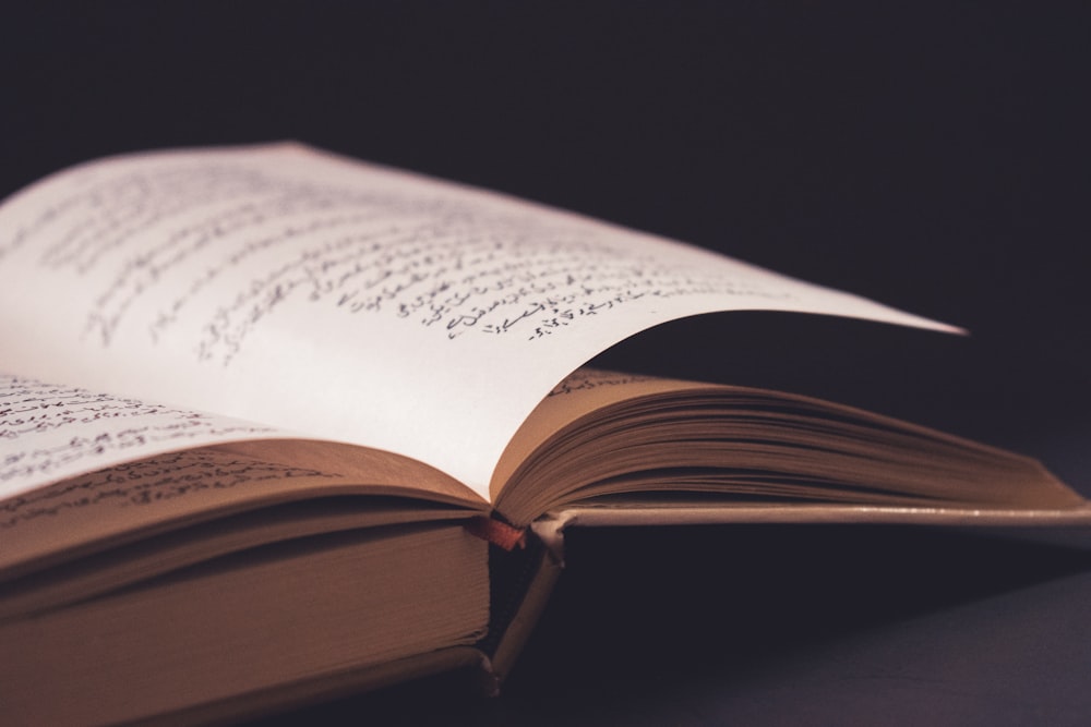 an open book sitting on top of a table