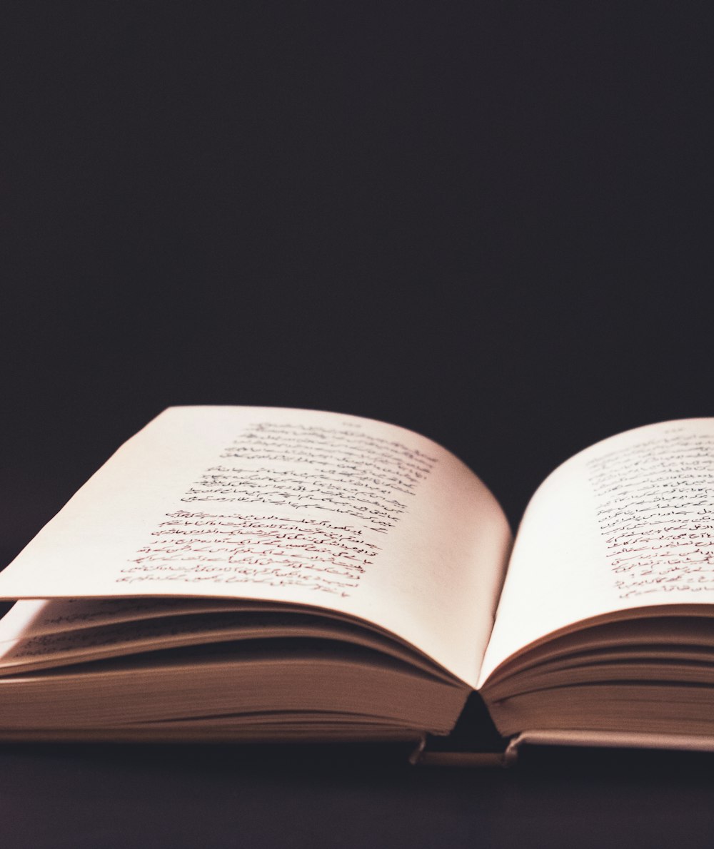 an open book sitting on top of a table