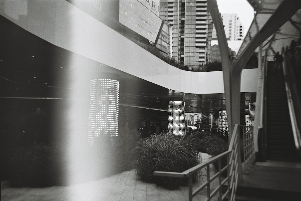 a black and white photo of a building and stairs