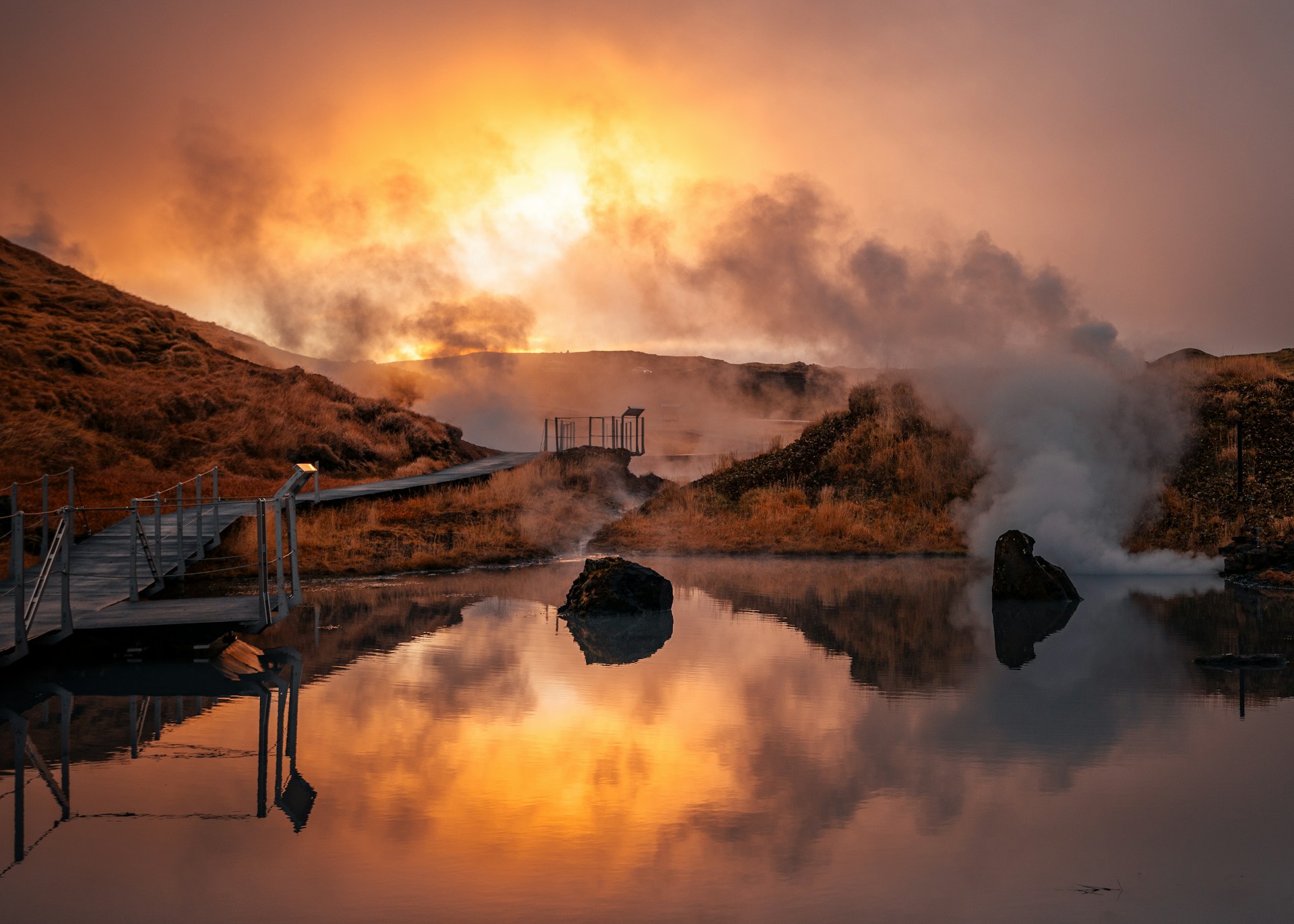 a body of water with steam coming out of it