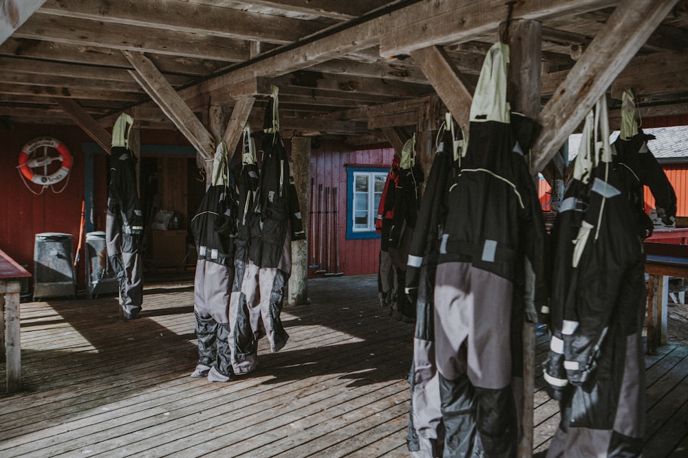 a group of people standing on a wooden floor