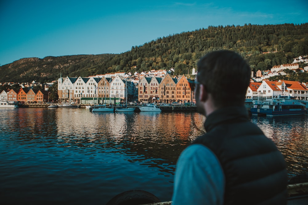 a man looking out over a body of water