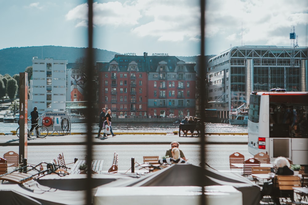 a view of a city from behind a fence