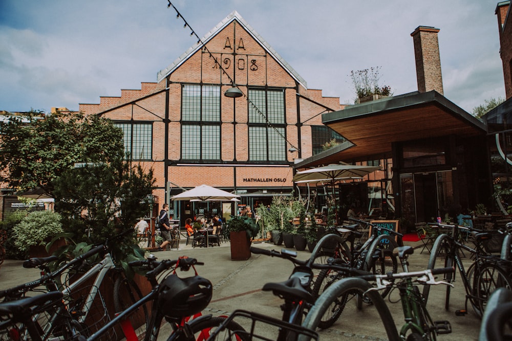 a group of bikes parked in front of a building