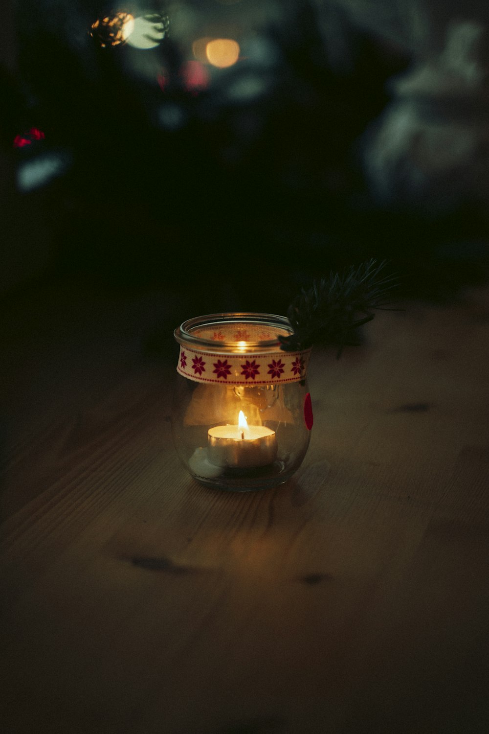 a lit candle is sitting on a table