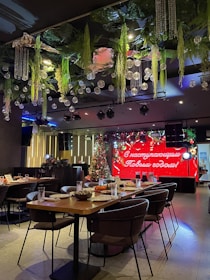 Festive event setup with decorated tables and happy guests.