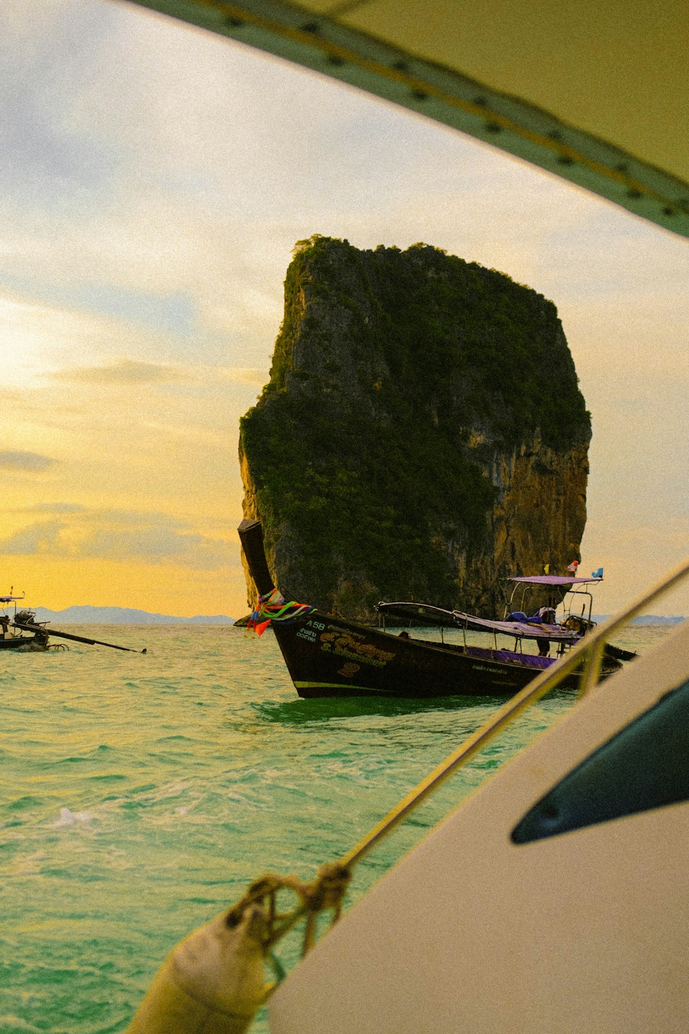 a group of boats floating on top of a body of water