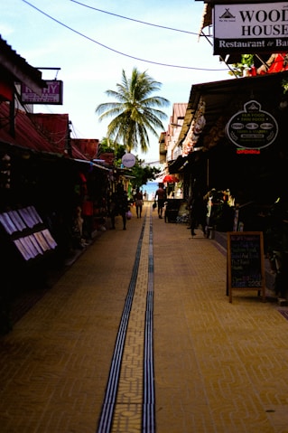 a street with people walking on the side of it
