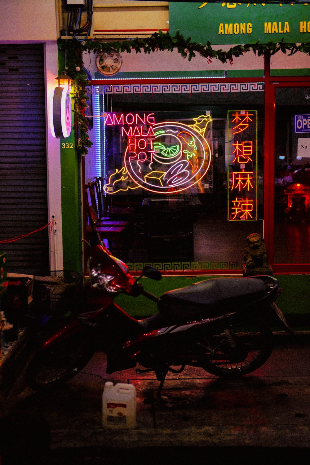 a motorcycle parked in front of a neon sign