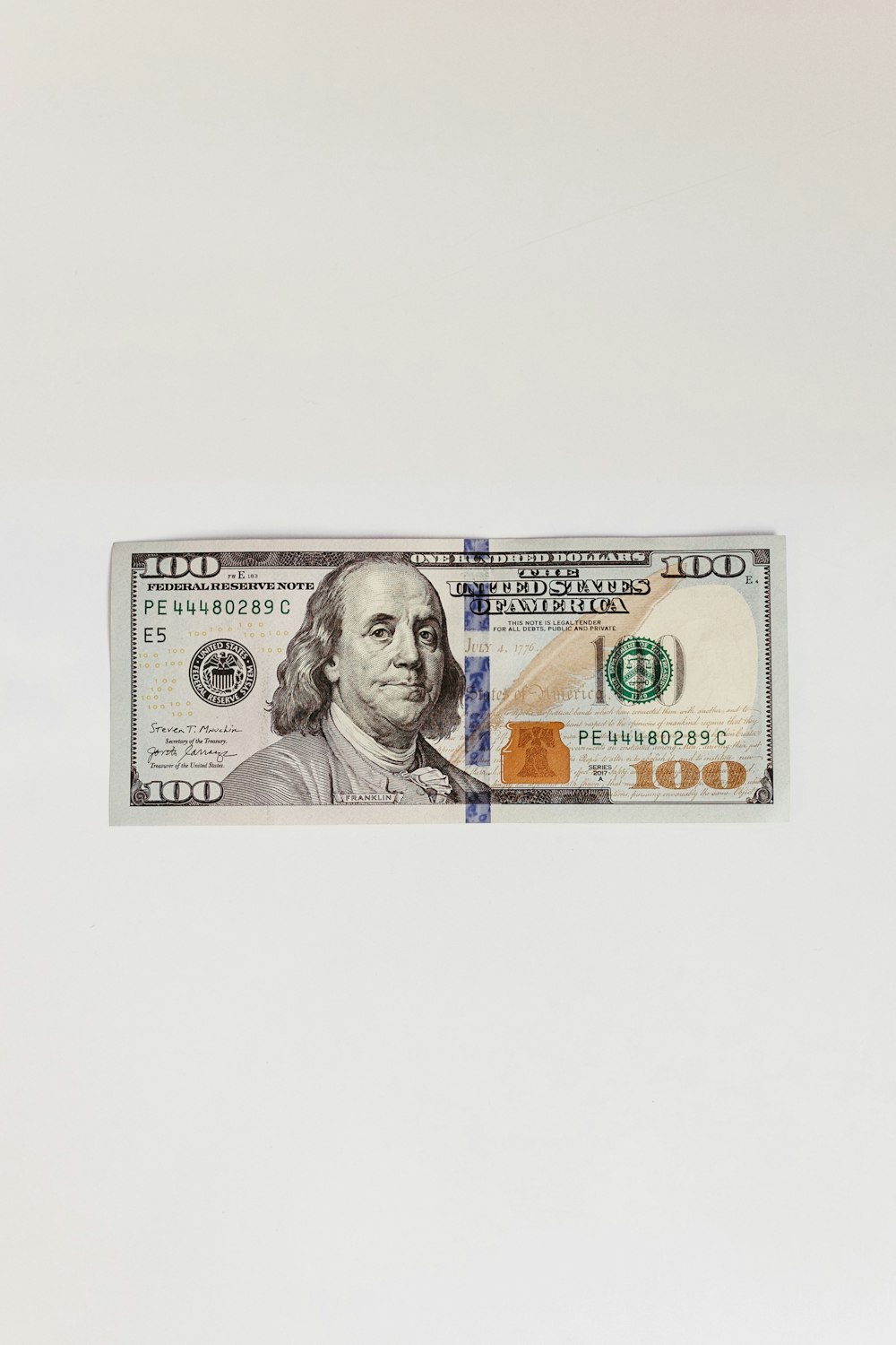 a one dollar bill with a picture of a man's face on it