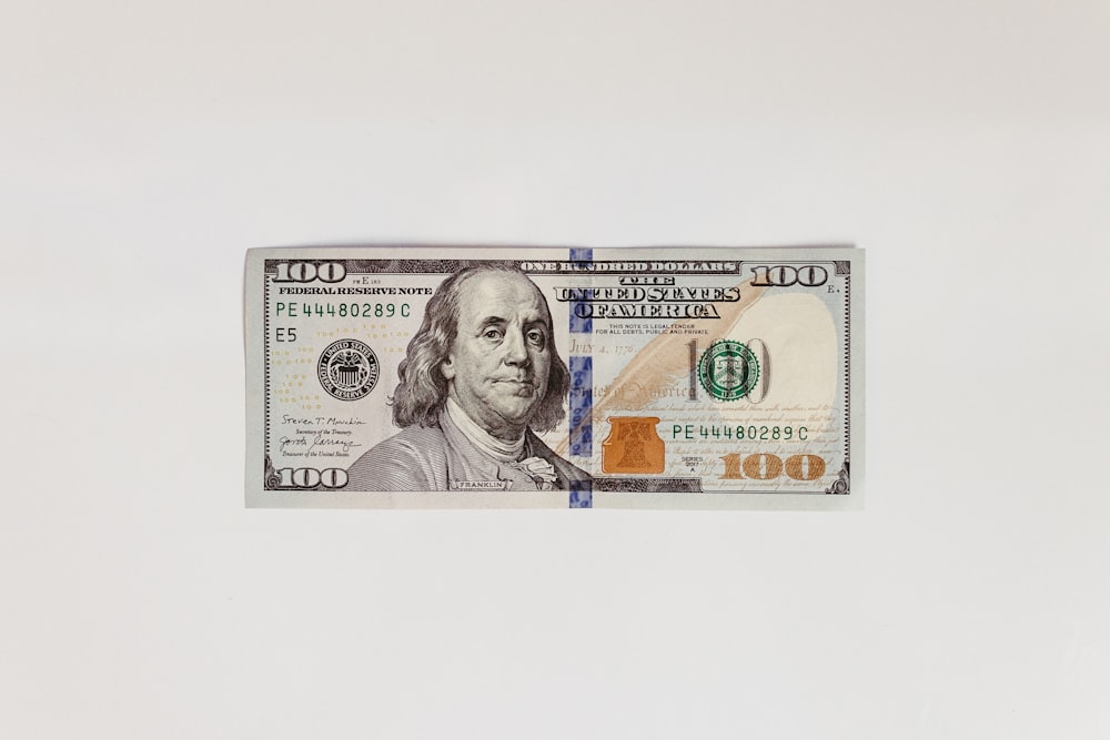 a one hundred dollar bill with a picture of a man's face on it
