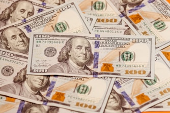 a pile of twenty dollar bills sitting on top of each other