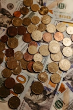 a pile of money sitting on top of a table