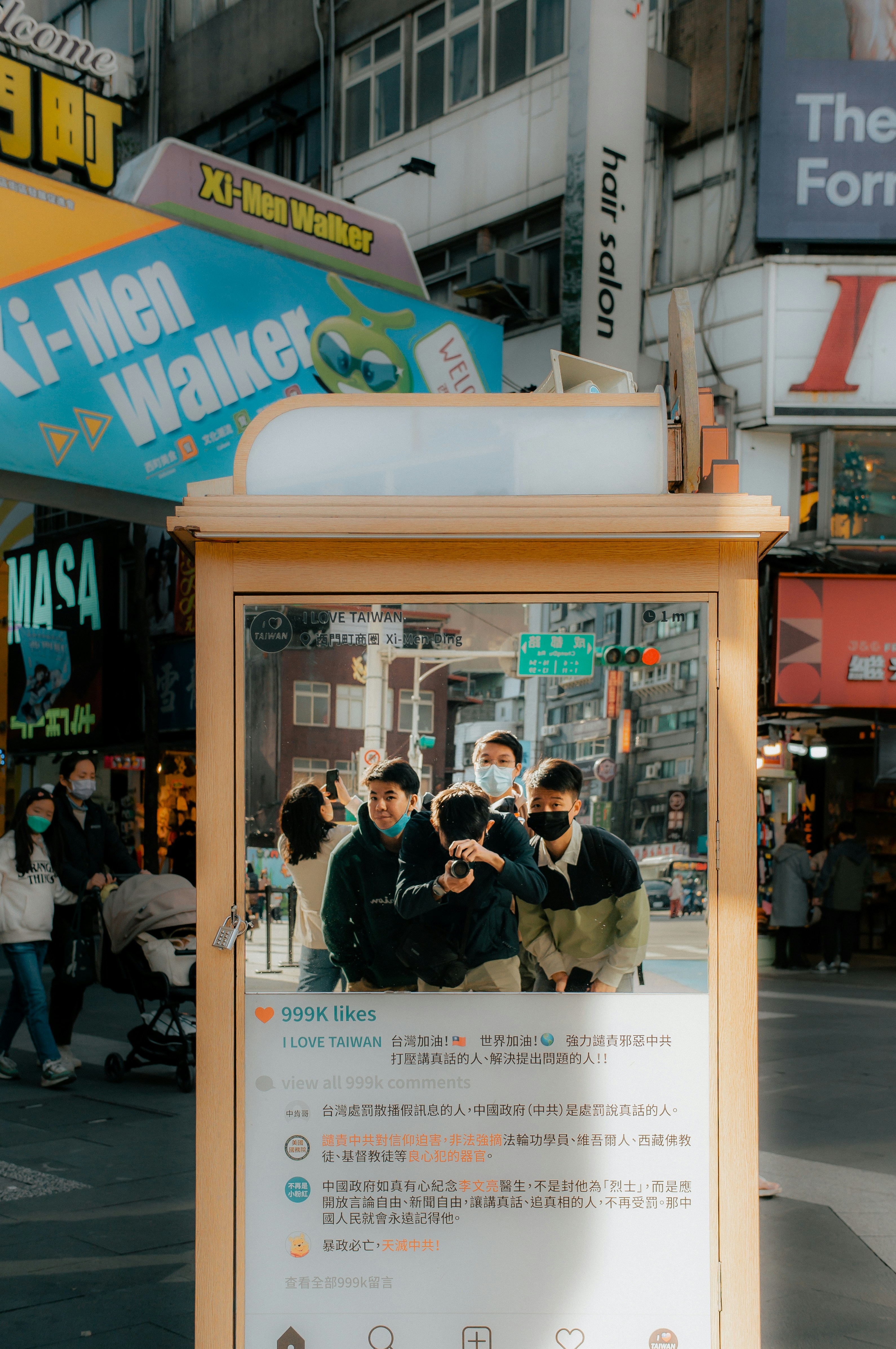A group of people standing in front of a sign photo – Free Street ...