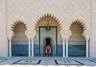 a person standing in a doorway of a building