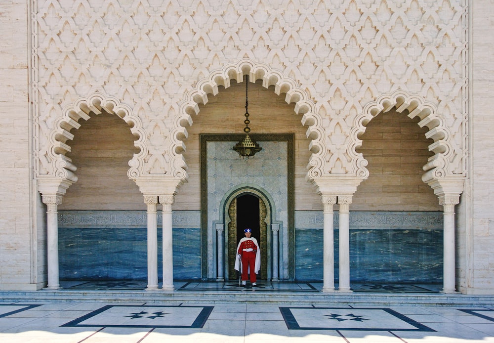 a person standing in a doorway of a building