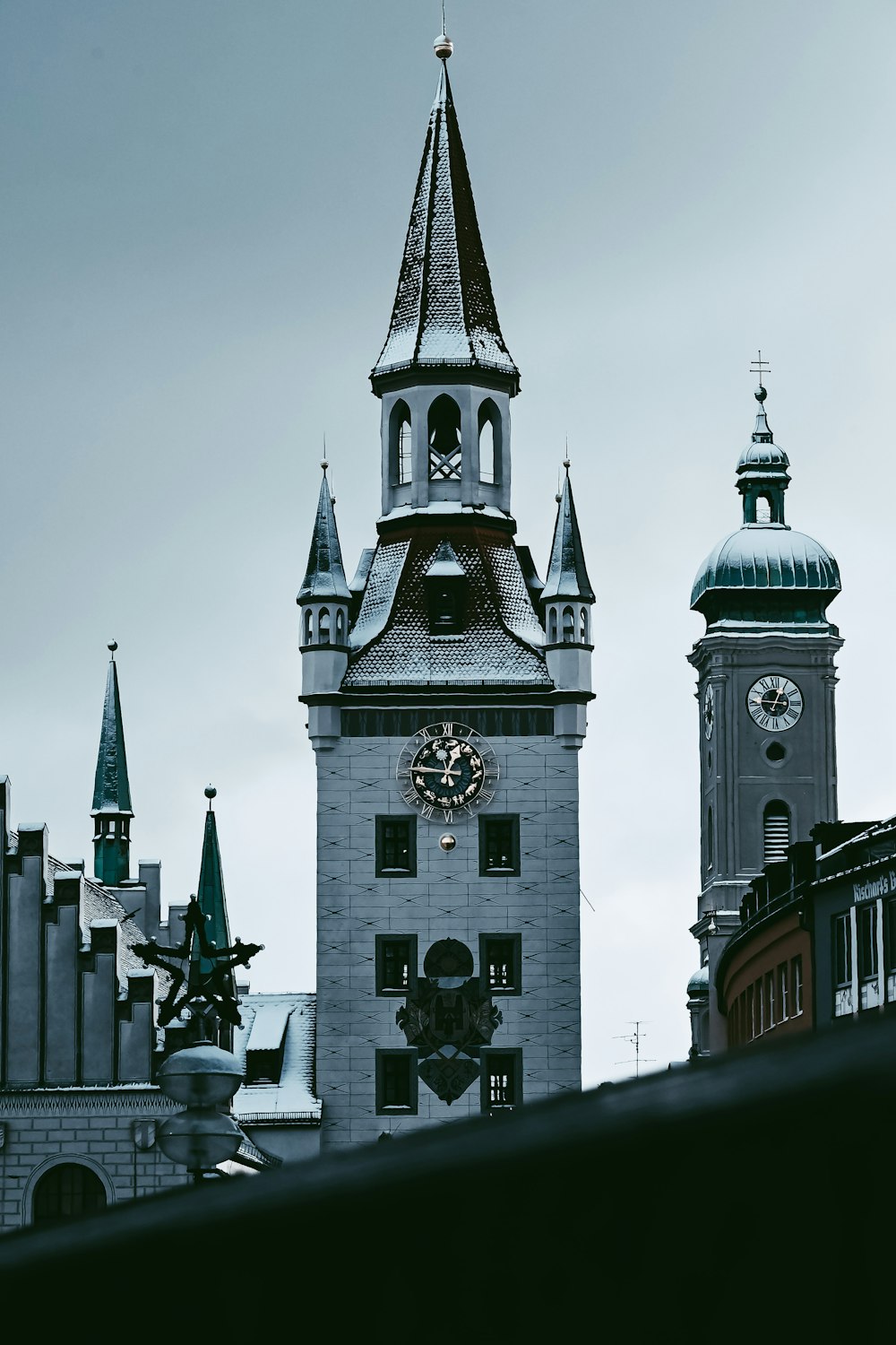 a tall clock tower with a clock on each of it's sides