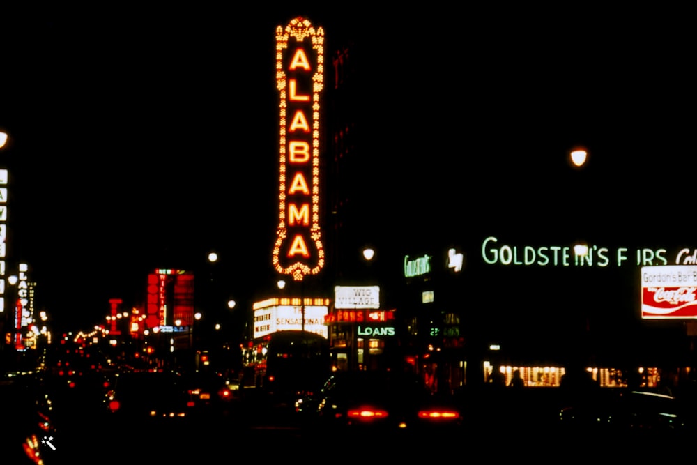 a view of a city at night from across the street