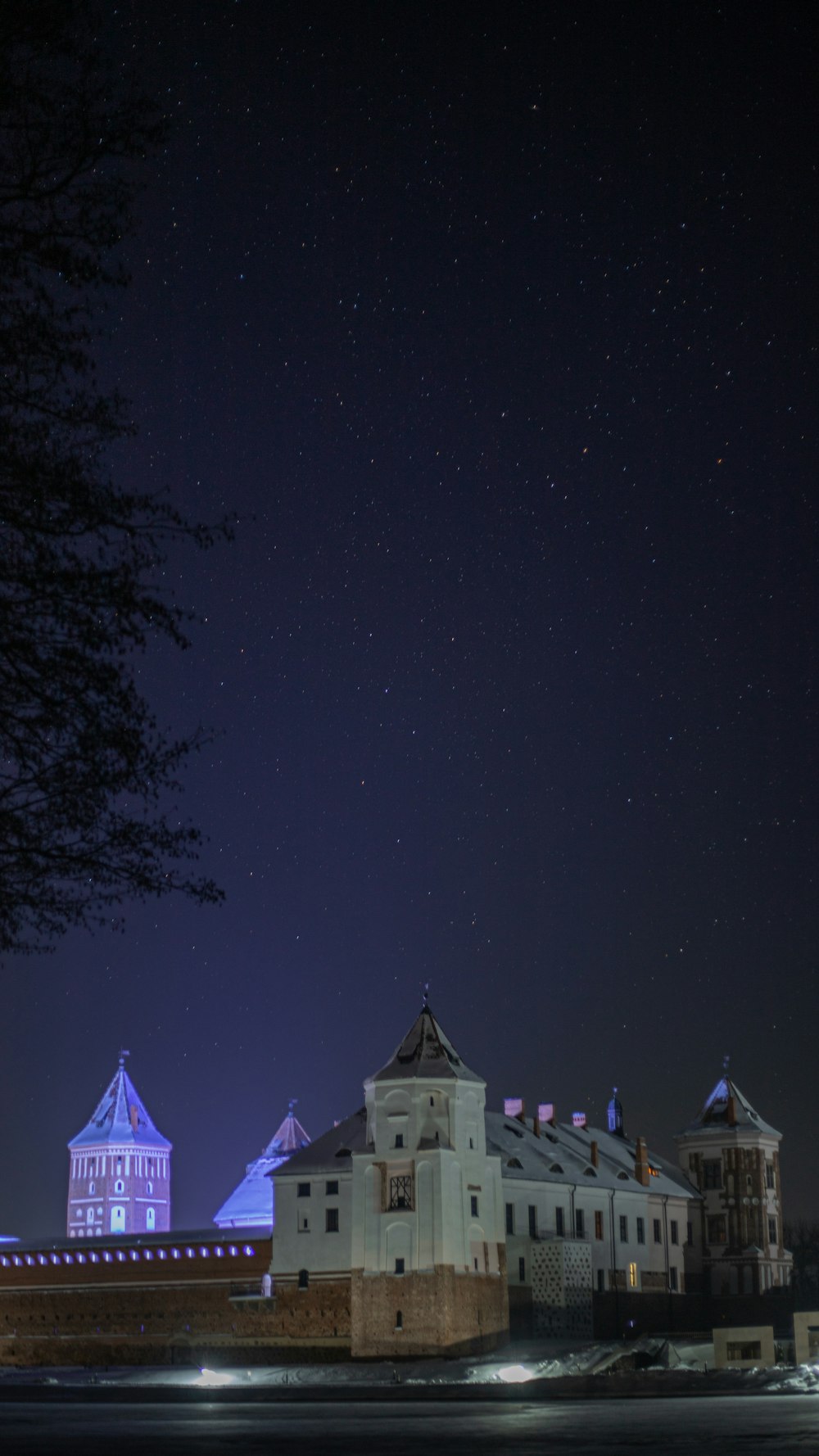 a night view of a building with a clock tower