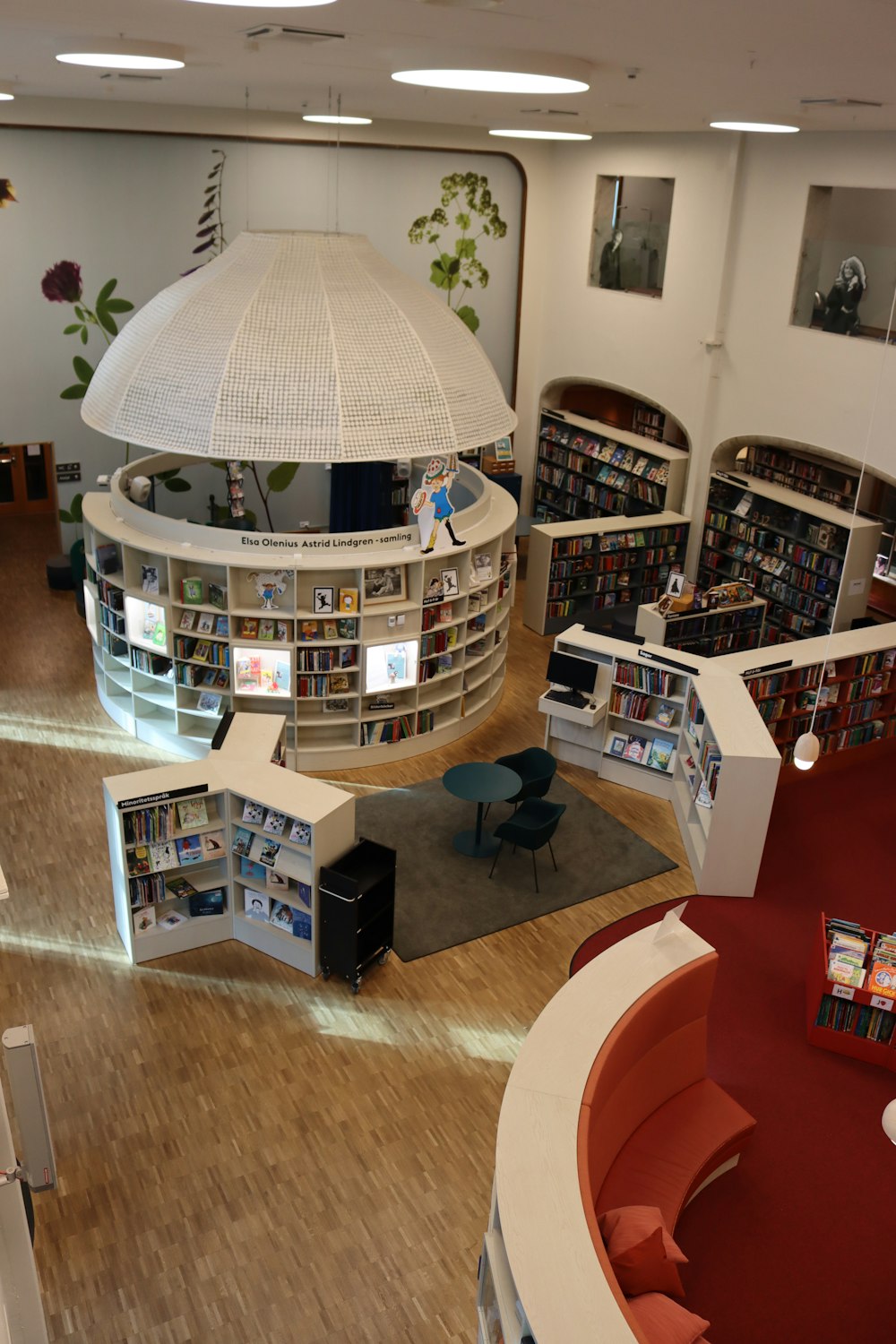 a library filled with lots of books and furniture