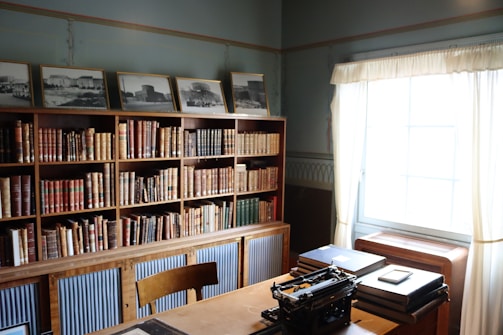 A serene study room filled with books and prayer items.