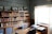 A serene study space with books on science and scripture, showcasing a warm atmosphere for learning.