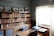 A serene study space with books on science and scripture, showcasing a warm atmosphere for learning.