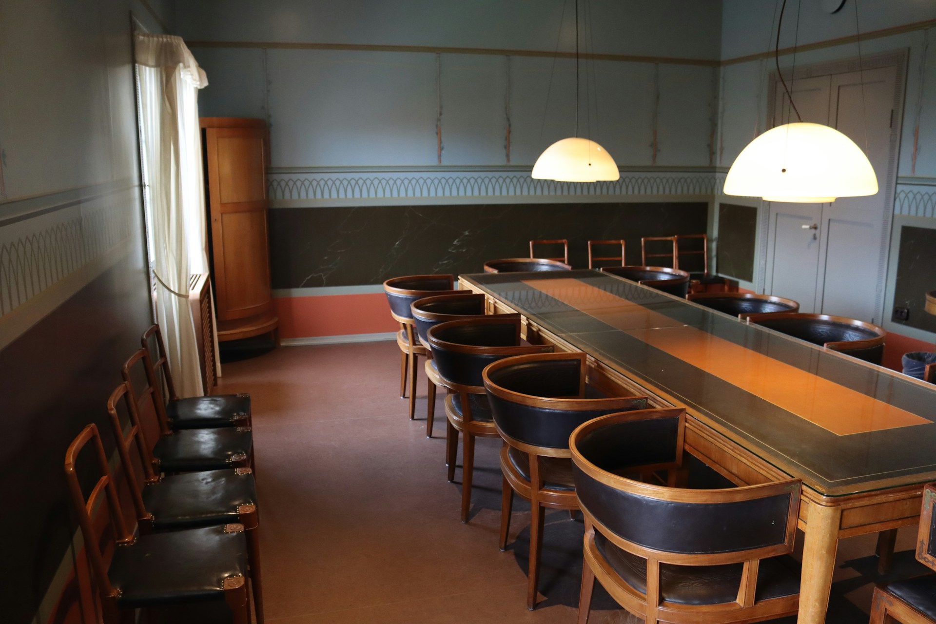 a room with a long table and many chairs