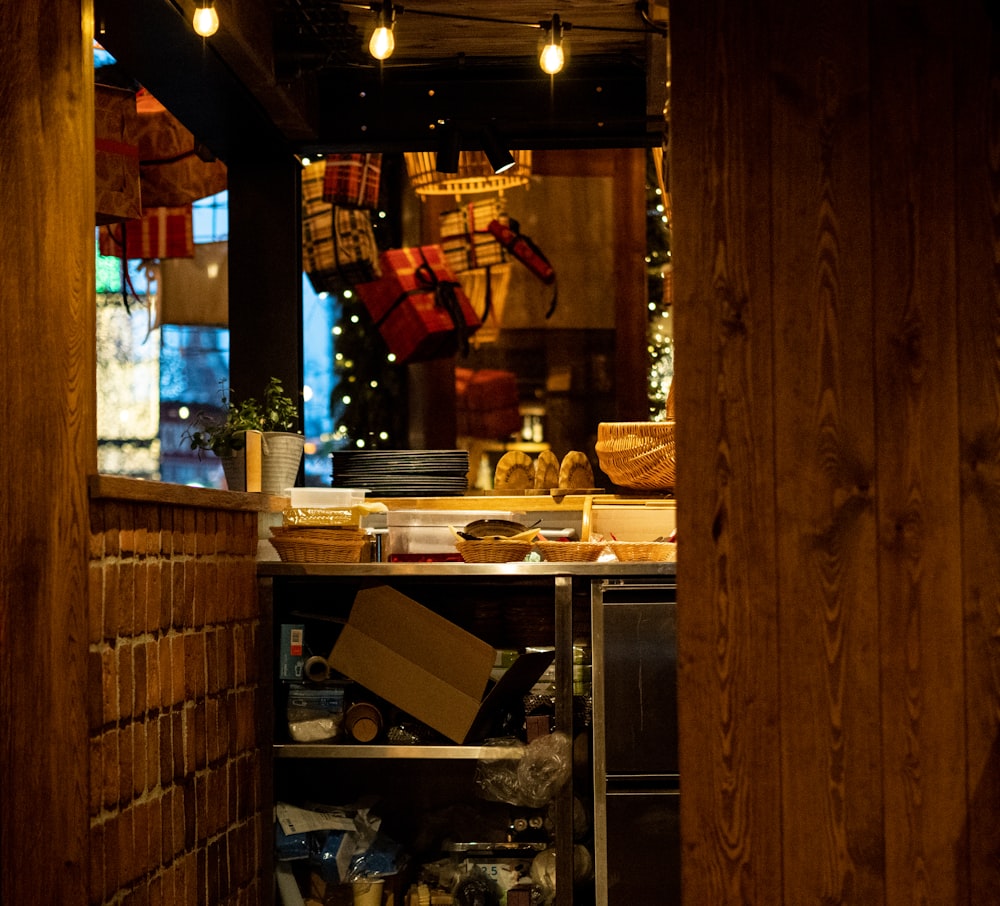 a kitchen filled with lots of food under lights