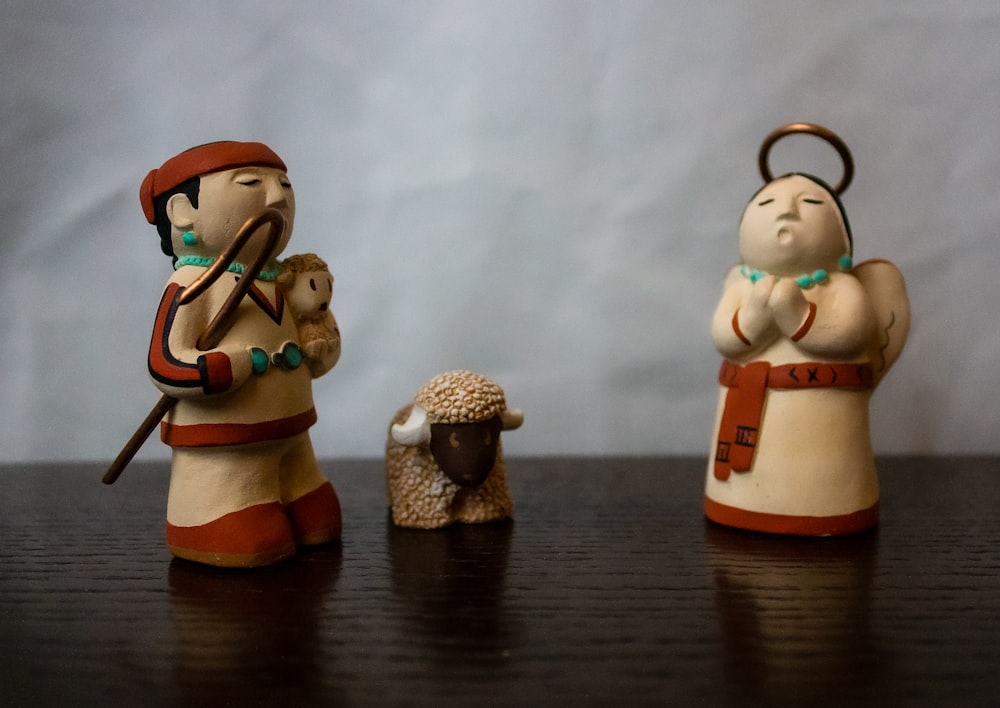 a couple of figurines that are on a table