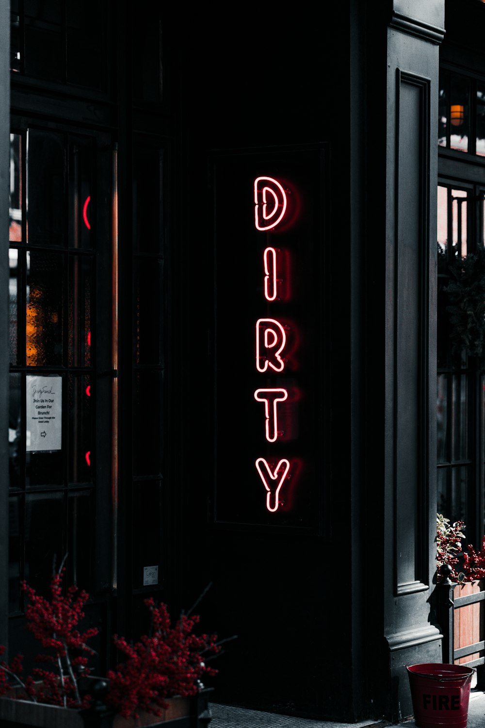 a neon sign on the side of a building