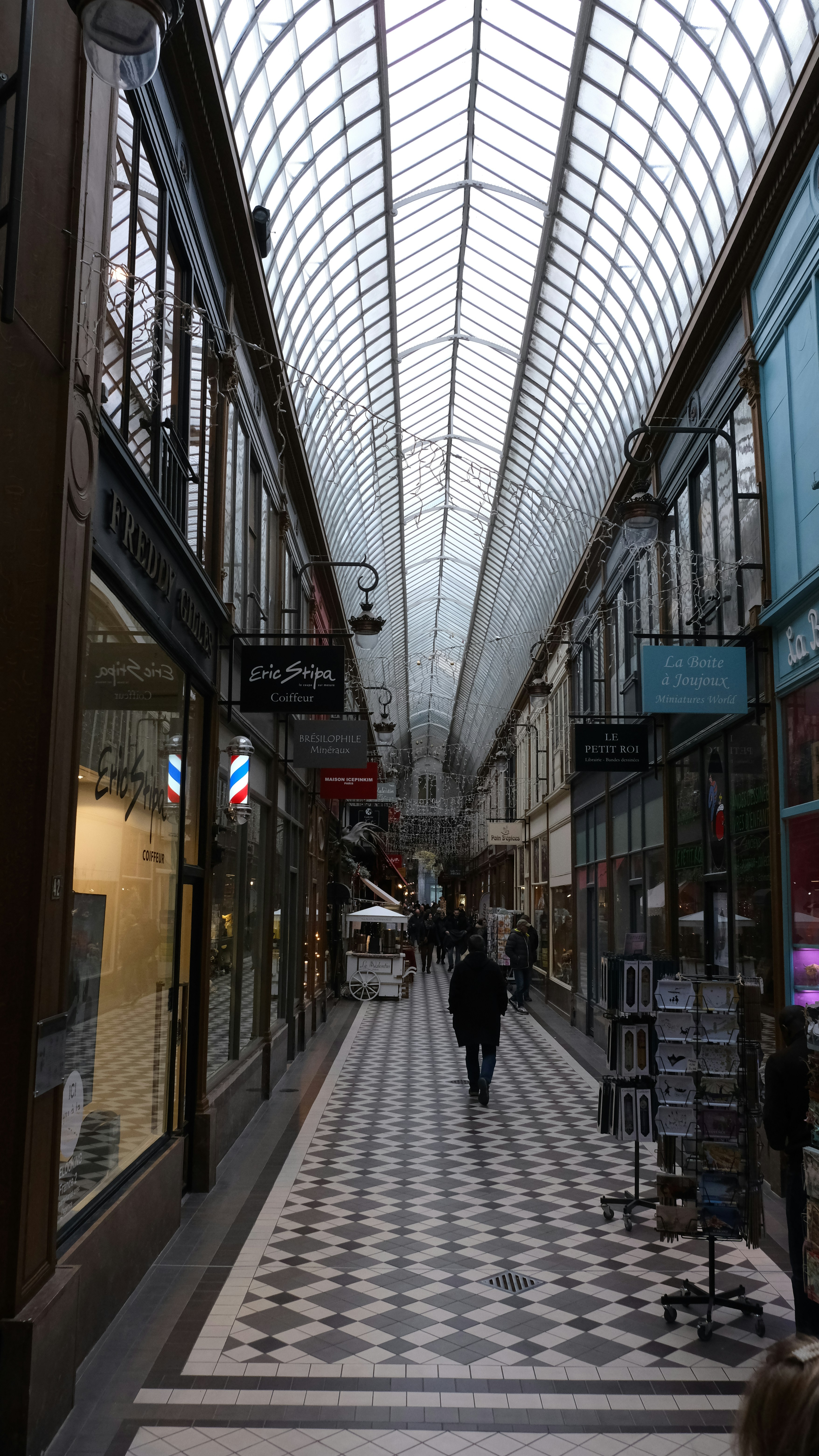 a couple of people that are walking down a street