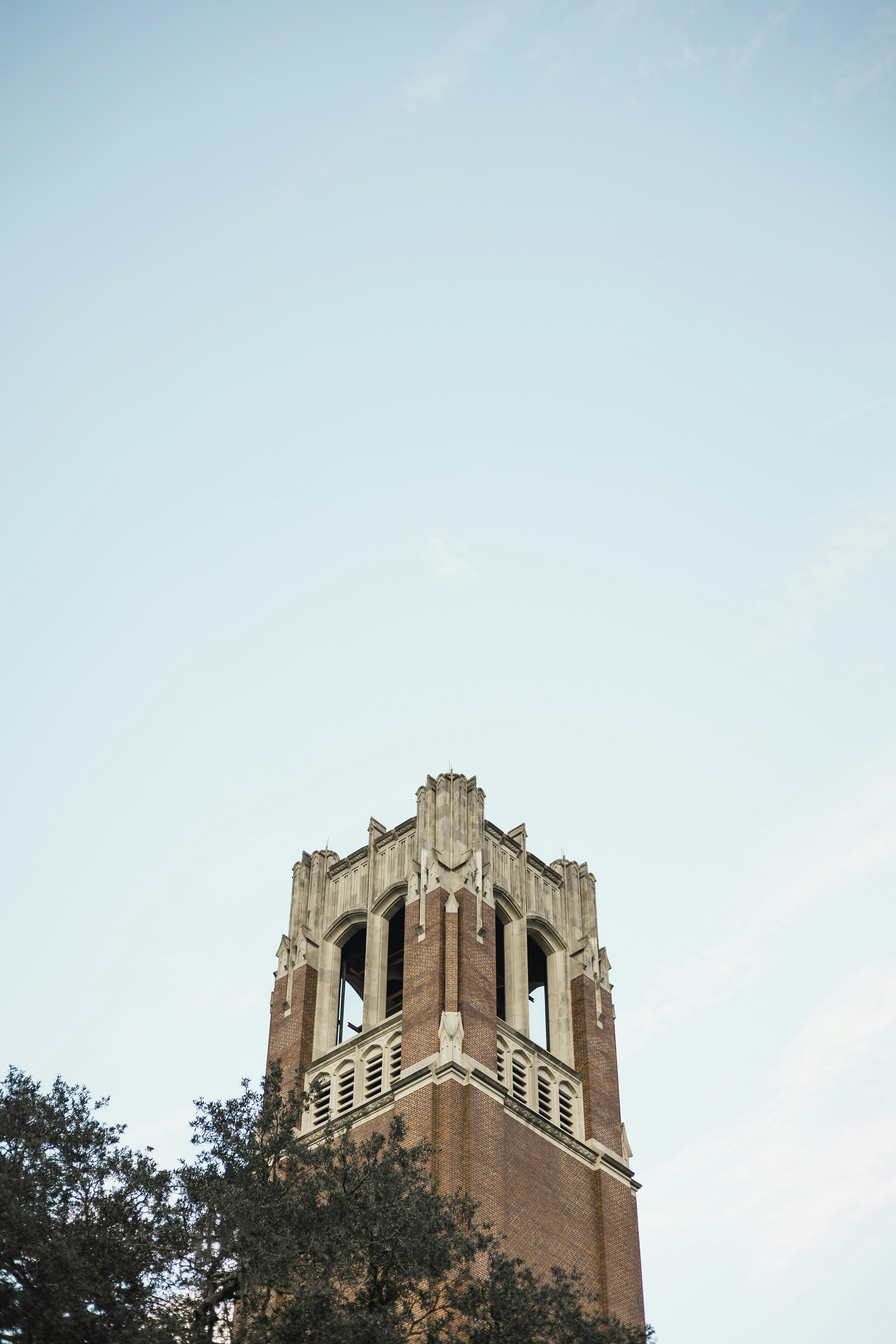 a tall tower with a clock on the top of it