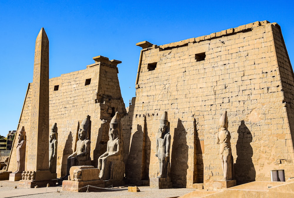 a group of statues in front of a building