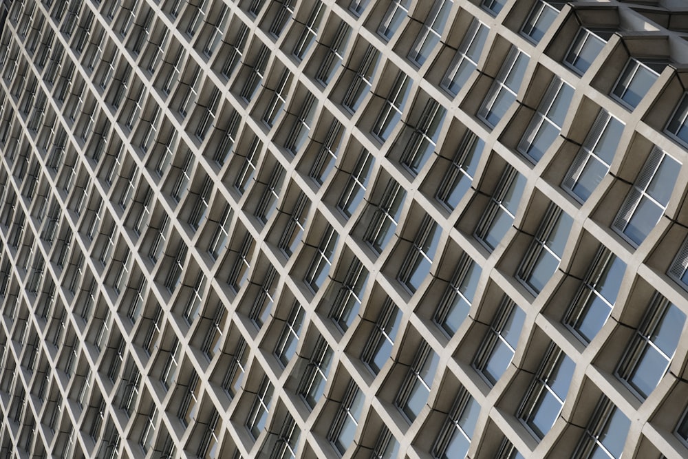 a tall building with lots of windows next to a traffic light