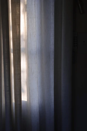Elegant blackout curtains installed in a stylish villa room with soft natural light