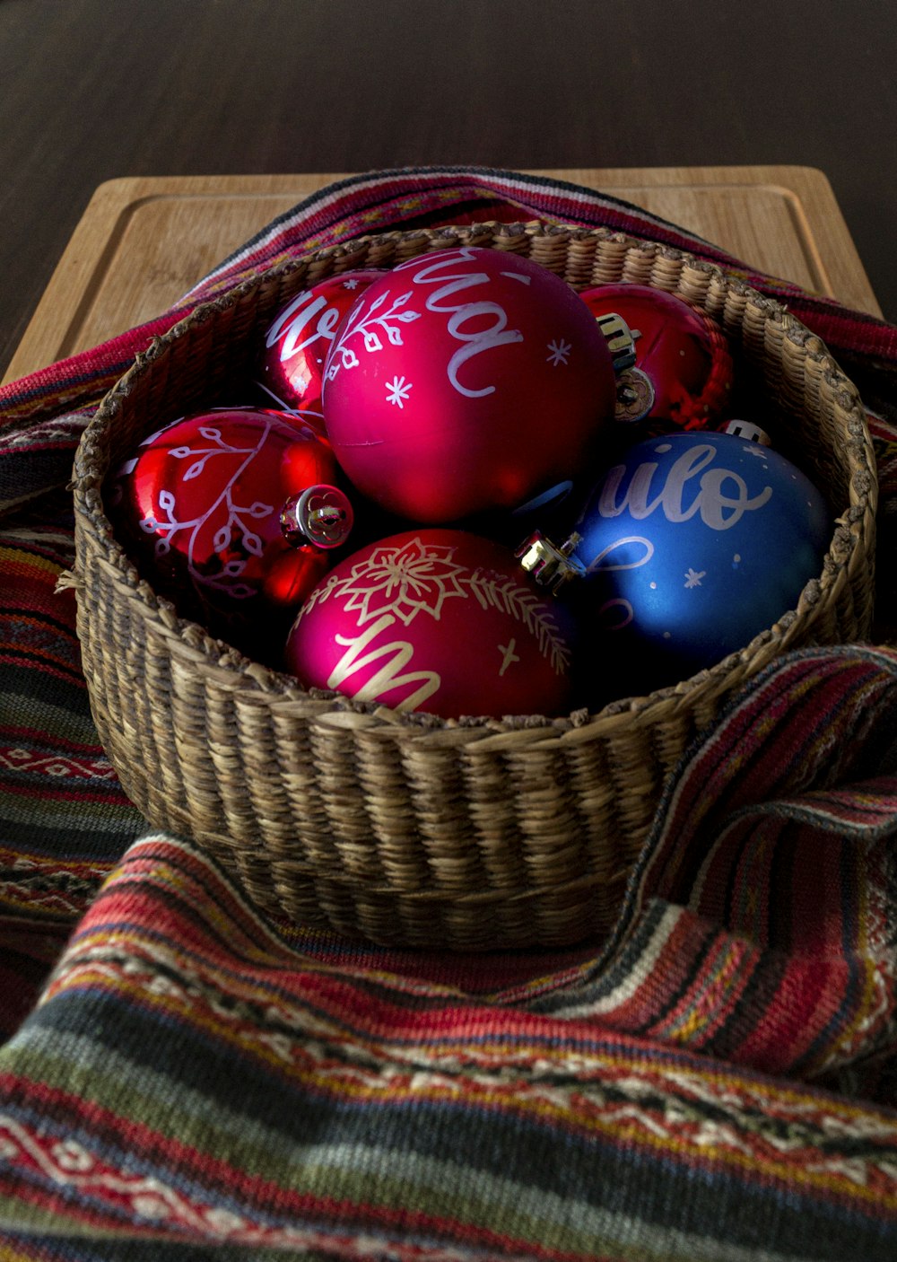 a basket filled with red and blue ornaments