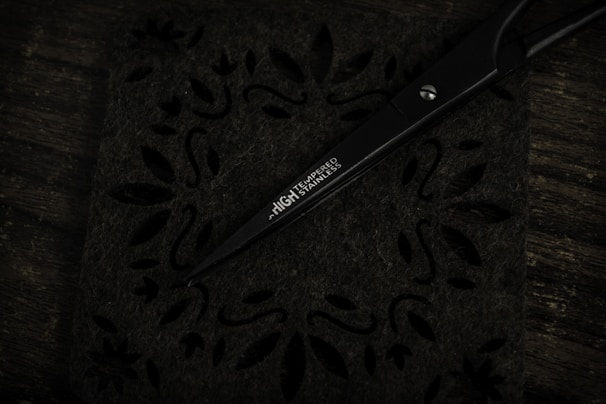 Close-up of finely crafted stainless steel scissors with polished handles.