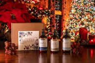 A festive scene with candles, rose petals, and Zucca Taller branded gifts ready to be sent.