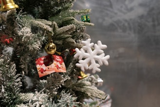 Close-up of a Christmas card featuring gold foil embossing and a 3D snowflake detail.