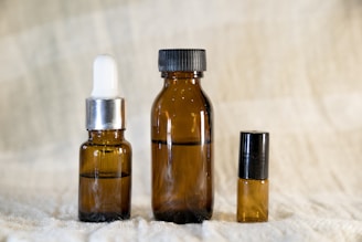 a couple of bottles sitting on top of a bed