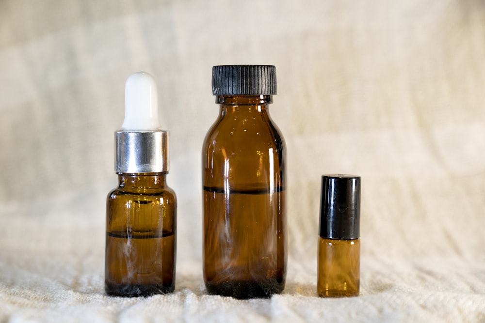 a couple of bottles sitting on top of a bed