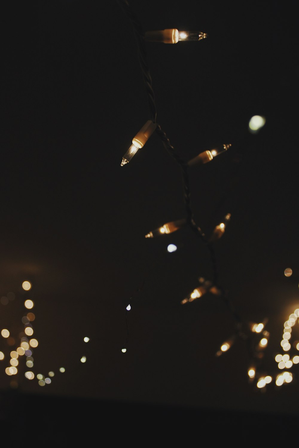 a string of lights hanging from a ceiling
