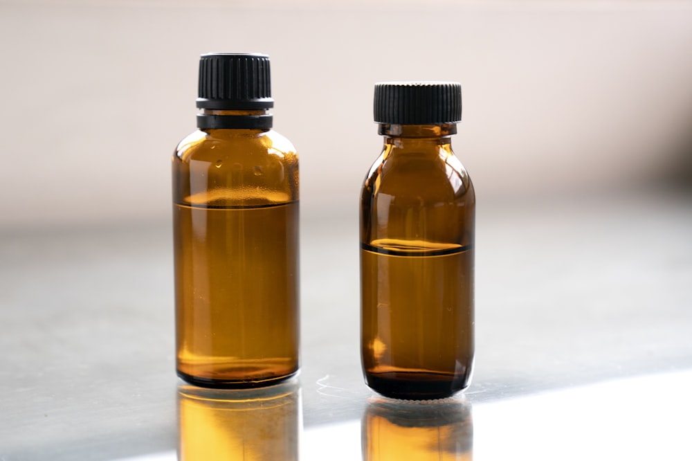 a couple of brown bottles sitting on top of a table